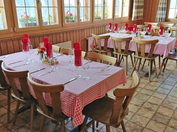 Guest lounge of the restaurant Springenboden A restaurant with tables laid for dining