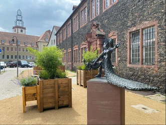 Statue outside museum on accessible pavement