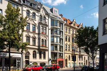 Belgian Quarter, Bismarckstraße Historic facades with trees and parked cars in Cologne's Belgian Quarter