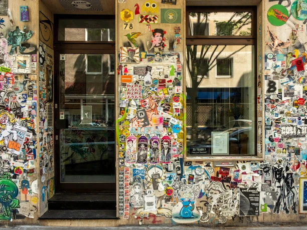 Belgian Quarter, Brüsseler Straße A building facade covered in street art and stickers in Cologne's Belgian Quarter