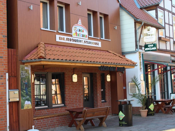 House facade of a Mexican restaurant with traditional half-timbering next to modern architecture.