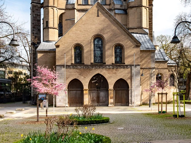 Sankt Gereon St. Gereon's Basilica in Cologne, with its towers, spring blossoms, and forecourt