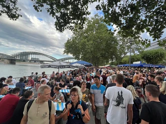 Cologne Beer Fair on the Rhine Promenade Cologne Beer Festival draws a large crowd to the Rhine promenade in front of the Hohenzollern Bridge
