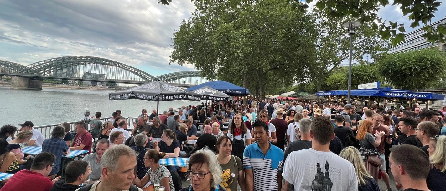 Cologne Beer Fair on the Rhine Promenade Cologne Beer Festival draws a large crowd to the Rhine promenade in front of the Hohenzollern Bridge