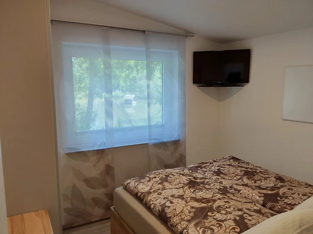 Ferienhaus am Mühlenteich, Schlafzimmer mit Fernsehen