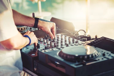 Dj,Is,Mixing,Music,With,Deejay,Controller,At,Outdoor,Summer Dj,Is,Mixing,Music,With,Deejay,Controller,At,Outdoor,Summer