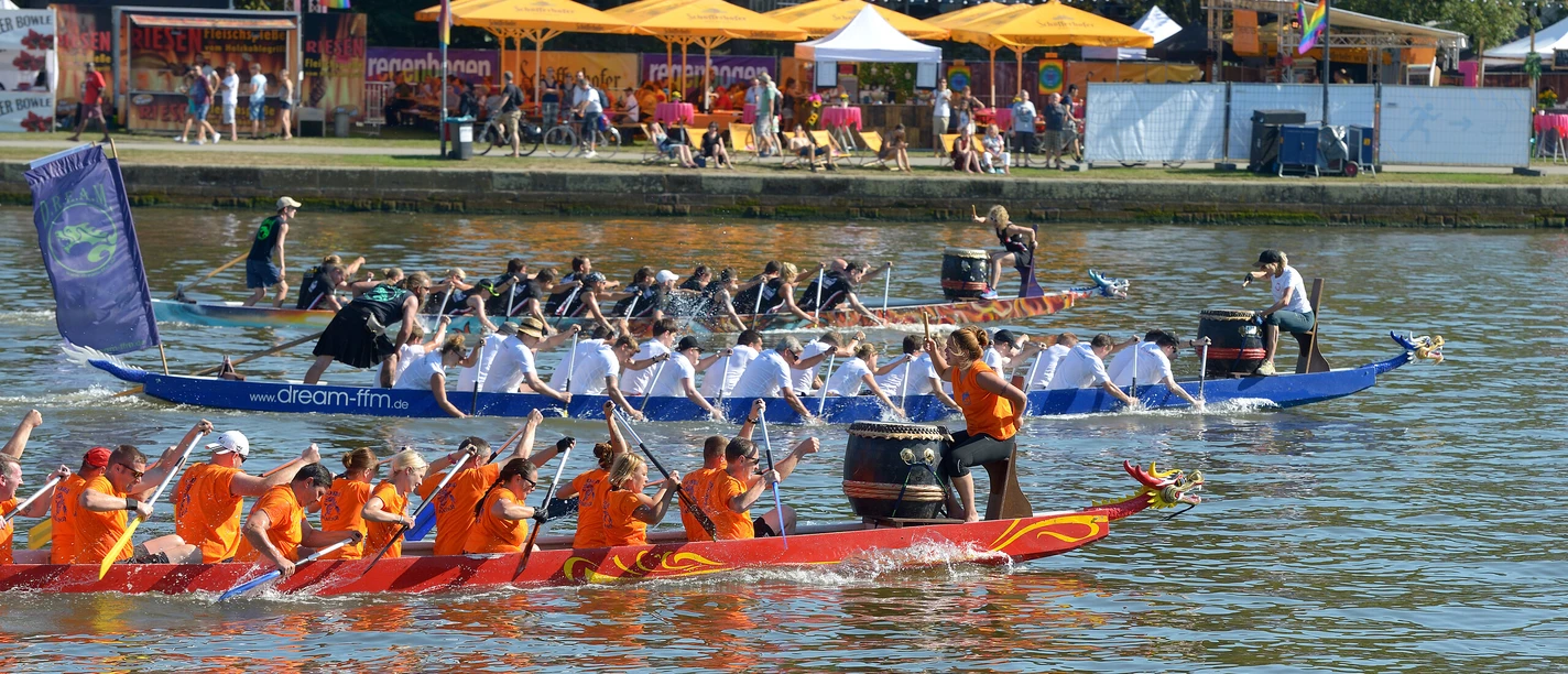 Dragon Boat Race Dragon boat race on the River Main with spectators on shore