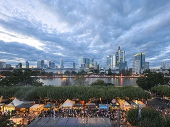 Frankfurt skyline and riverside stalls in the evening