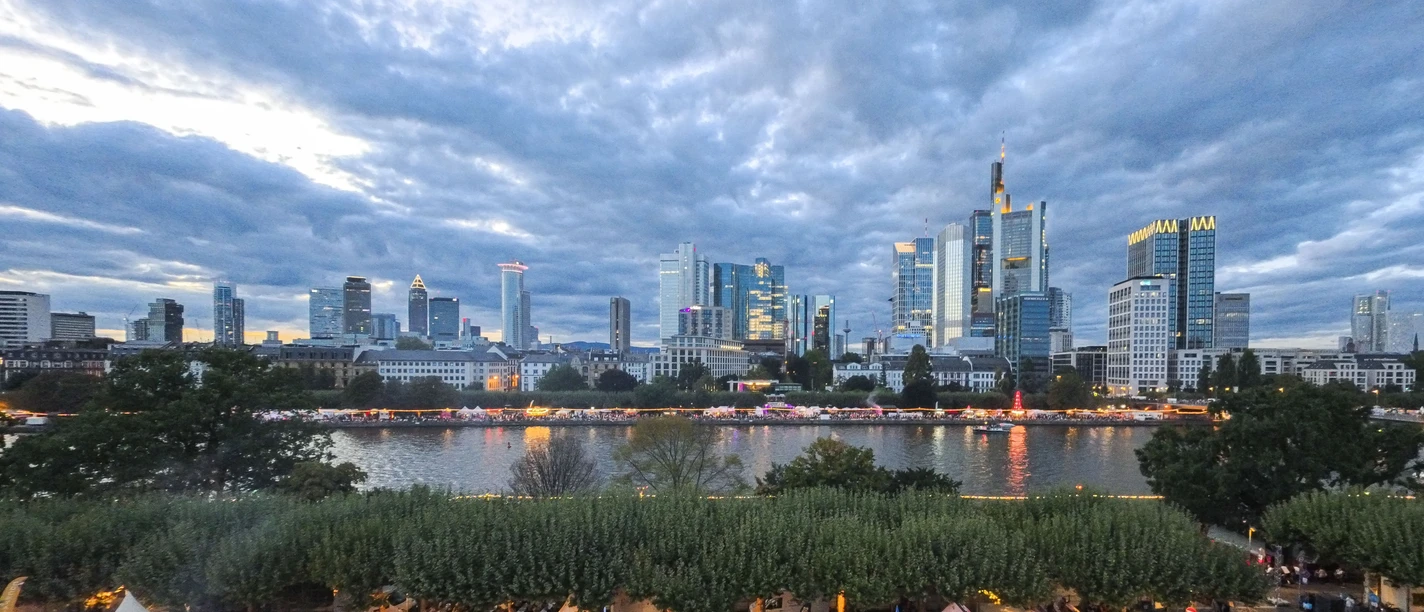 Frankfurt skyline and riverside stalls in the evening