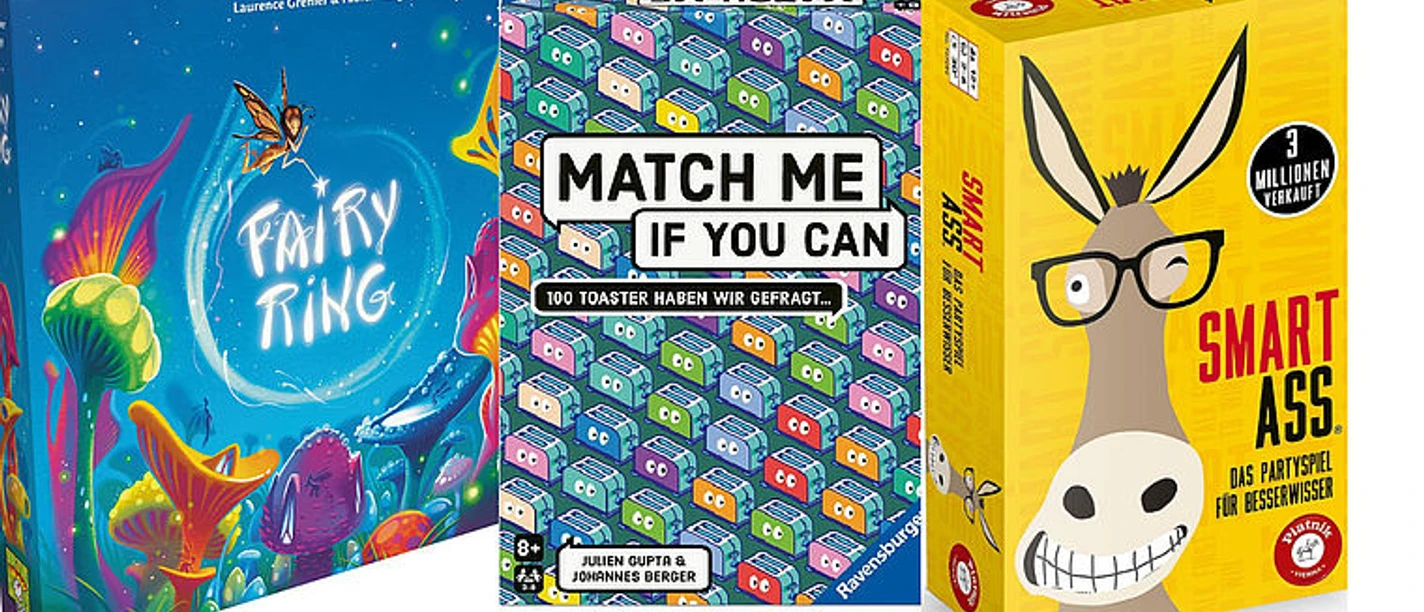 Drei bunte Spieleschachteln für einen Spieleabend in der Stadtbibliothek