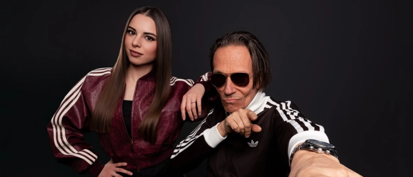 C-Block feat. Franky Miller Zwei Personen in sportlichen Outfits posieren vor schwarzem Hintergrund.