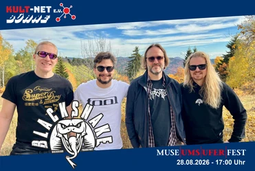 KULT-Net e.V. - BLACKSNAKE Four band members are smiling outside for a photo