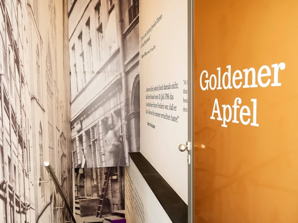 Golden Apple in Frankfurt: stairwell with text panels and handrails
