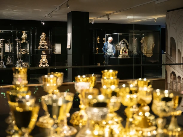Golden Candlestick and Sacred Art on Display in the Frankfurt Cathedral Museum's Display Cases