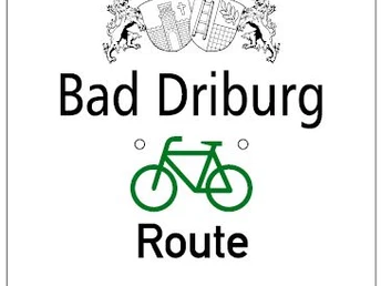 Bad Driburger Radrouten, Wegweiser Tour 5 Wegweiser der Radroute Tour 5 in Bad Driburg mit stilisiertem Fahrradsymbol und Stadtwappen.