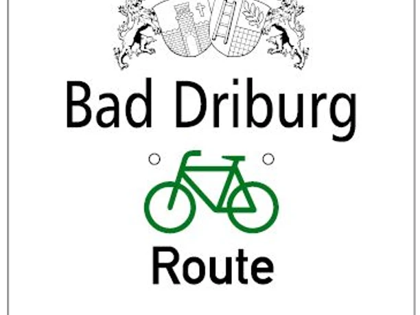 Bad Driburger Radrouten, Wegweiser Tour 5 Wegweiser der Radroute Tour 5 in Bad Driburg mit stilisiertem Fahrradsymbol und Stadtwappen.