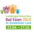 Logo der Landesgartenschau Bad Essen 2010 mit farbigen symbolischen Gebäuden und Datum.
