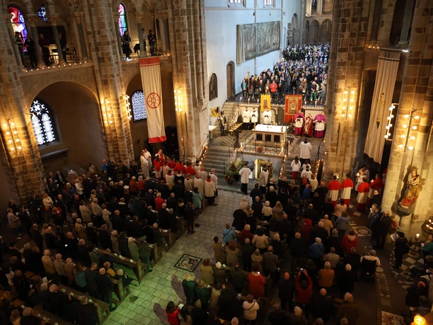 Festive service at St. Gereon with clergy, choir, and a large congregation