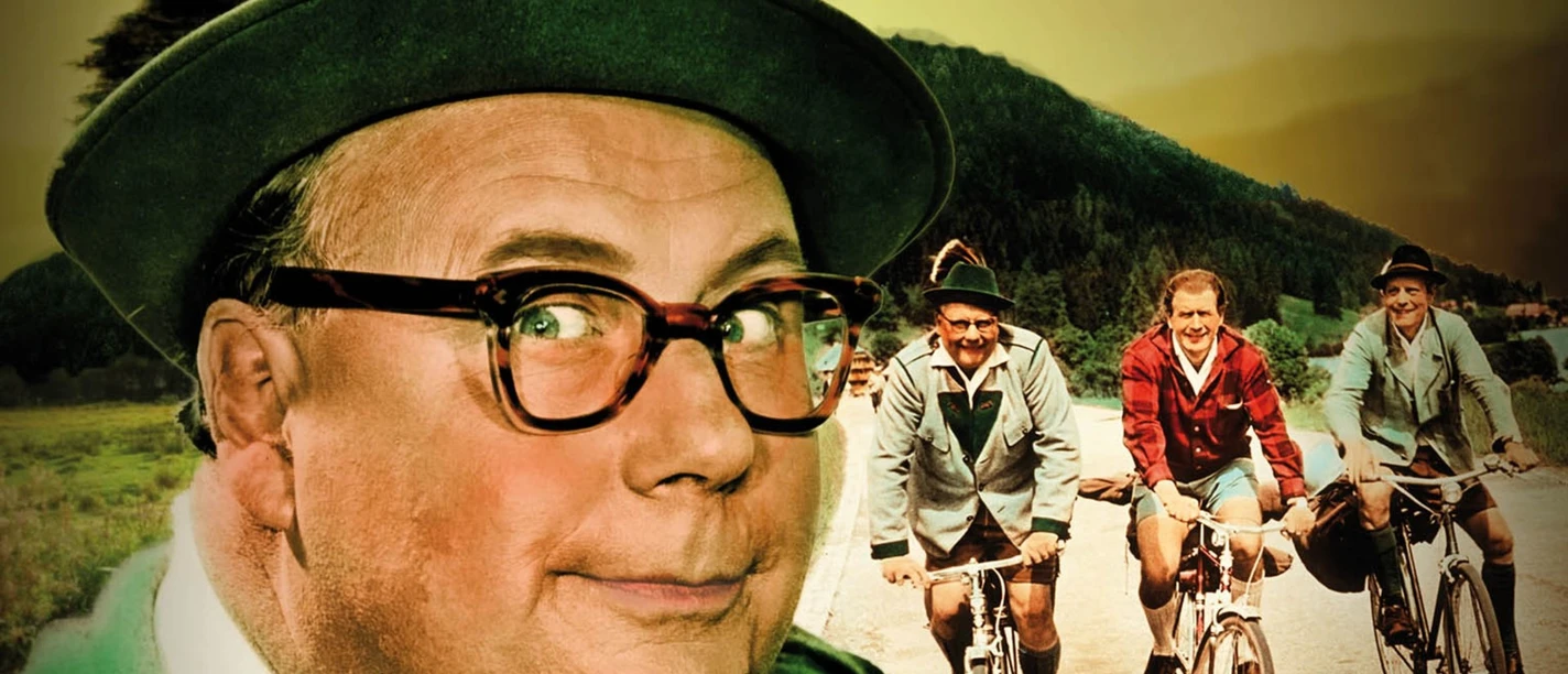Filmplakat "Immer die Radfahrer" Filmplakat zu „Immer die Radfahrer“ mit Heinz Erhardt und drei Radfahrern in Berglandschaft.