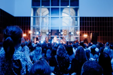 Cologne Museum Night 2026 Audience in front of a blue-lit stage during a live music performance at Cologne Museum Night