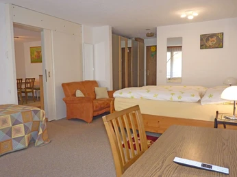 One double bed and one single bed with table