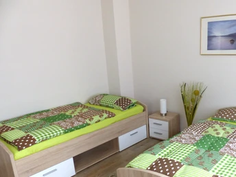 Schlafzimmer mit Einzelbetten der Ferienwohnung Brandt Schlafzimmer mit Einzelbetten der Ferienwohnung Brandt