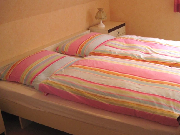 Eines von drei Schlafzimmern im Ferienhaus Geestequelle Eines von drei Schlafzimmern im Ferienhaus Geestequelle