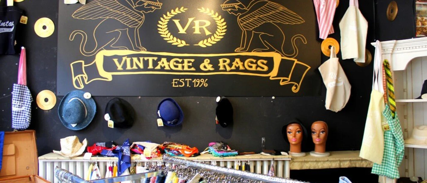 Vintage & Rags A store with retro clothing, hats and mannequins