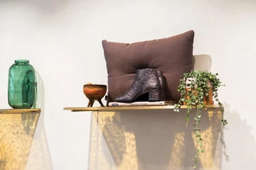 No59 Conceptstore Cologne A stylish wooden shelf with decor.