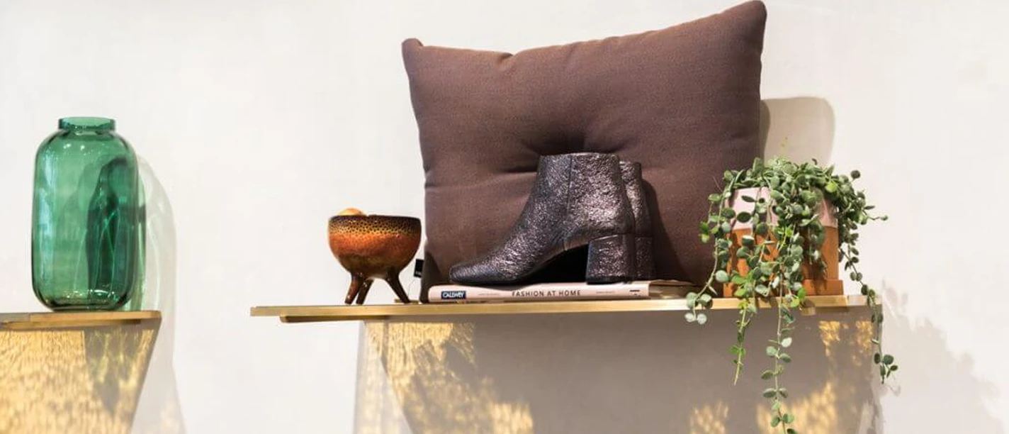 No59 Conceptstore Cologne A stylish wooden shelf with decor.