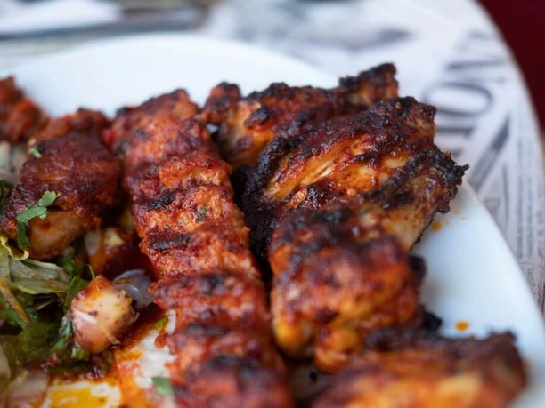 Kebapland Close-up of the house specialty, Adana skewers.