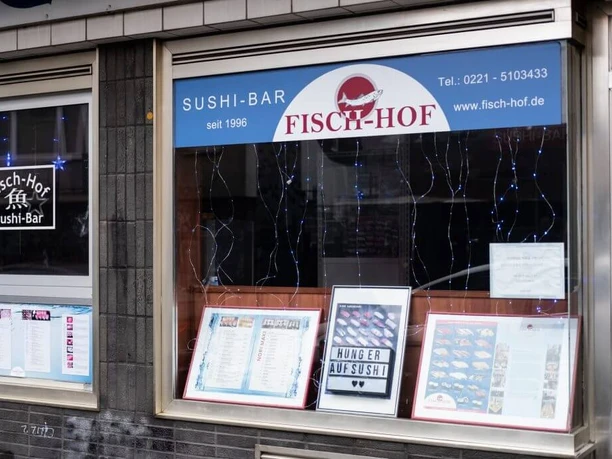 Fisch Hof Sushi Haus View of the restaurant. In the shop window, the menu is laid out in picture frames.