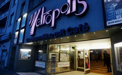 Metropolis The picture shows the Metropolis Kino, a charming arthouse cinema with an adjoining café. The bright façade attracts the attention of visitors with its striking lettering.