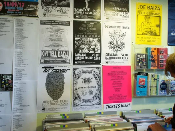 Underdog Recordstore A colorful poster and record store with a versatile range of music genres.