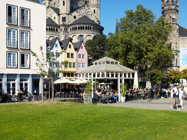 Cologne's old town with Groß St. Martin View of the Romanesque church Groß St. Martin in Cologne, surrounded by colorful old town houses.