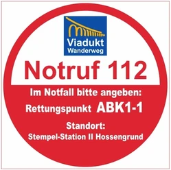 Rundes Notruf-Schild für den Viadukt-Wanderweg mit Rettungspunkt ABK1-1 und Standortangabe.
