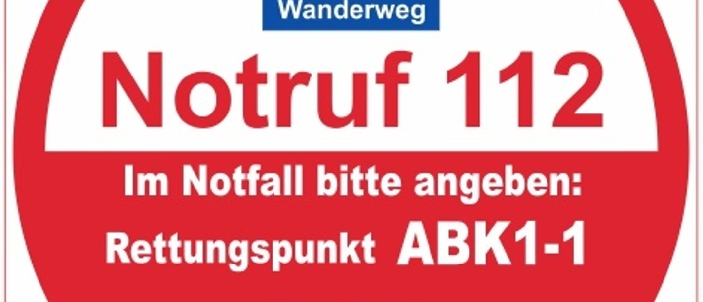 Rettungspunkt ABK1-1 Rundes Notruf-Schild für den Viadukt-Wanderweg mit Rettungspunkt ABK1-1 und Standortangabe.