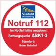 Rettungspunkt ABK1-3 Runder Notfallhinweis mit Rettungspunkt ABK1-3 am Viadukt Wanderweg, Standpunkt Buker Bahnhof.