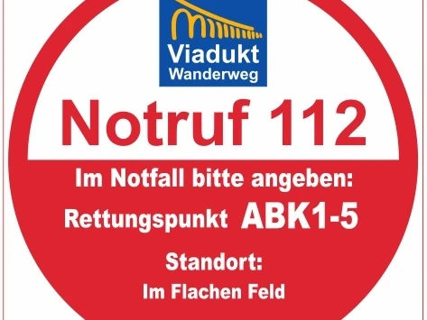 Rettungspunkt ABK 1-5 Roter Notrufpunkt-Aufkleber mit der Aufschrift "Rettungspunkt ABK1-5" und Notrufnummer 112.