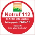 Roter Notruf-Hinweis Paderborner Höhenweg, PAD 2-13, für schnelle Hilfe in Notfällen.