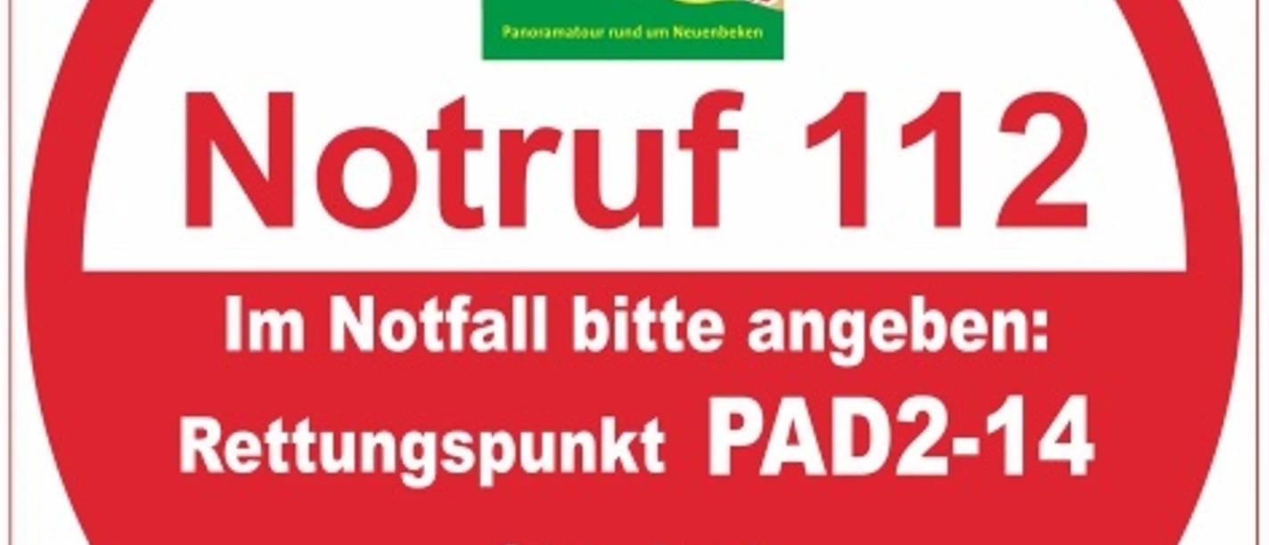 Rettungspunkt PAD2-14 Rundschild mit Notrufhinweisen für Rettungspunkt PAD2-14 am Paderborner Höhenweg, Standort Mittelholz-Südwest.