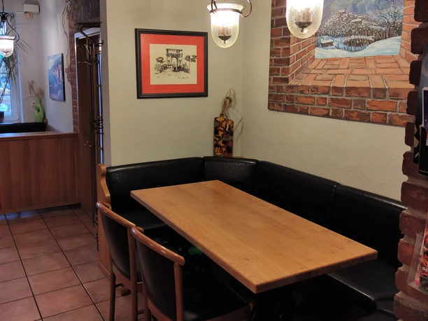 Sitzgruppe innerhalb der Pizzeria Roma