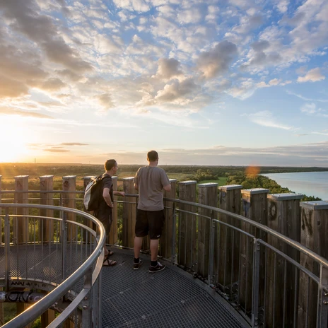 Two men stand on the Bistumshöhe viewing platform and enjoy a panoramic view over Lake Cospuden and the adjacent green spaces, Leisure, Leipzig New Lake District