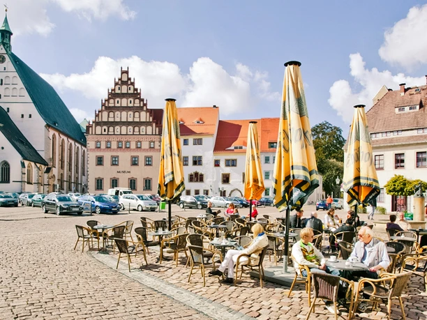 Historic architecture and café terrace on the market square in Freiberg.