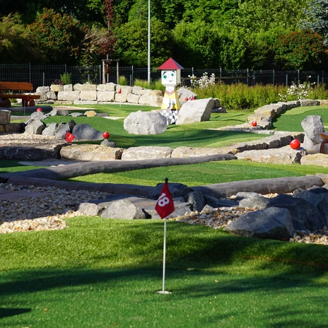 View of the mini-golf course at the adventure golf park in Groitzsch, with the Bieraterie bistro in the background, leisure, family, mini-golf, gastronomy, Leipzig with children