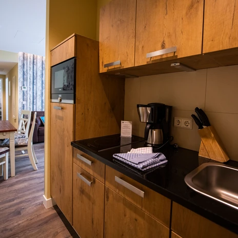Bild einer Küchenzeile in einem Apartment der Unterkunft Apartment Central in Leipzig, Übernachtung, Hotel, Ferienwohnung