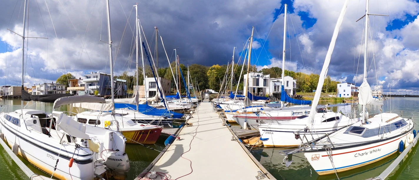 Sailing harbor on Lake Hain in Leipzig's Neuseenland region On a sunny day, the sailing harbor on Lake Hain shows stylish sailboats on moorings.