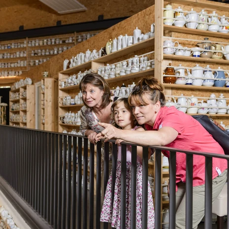 A family stands in the "O", the multifunctional hall in O-Schatz Park, and marvels at the huge collection of coffee pots