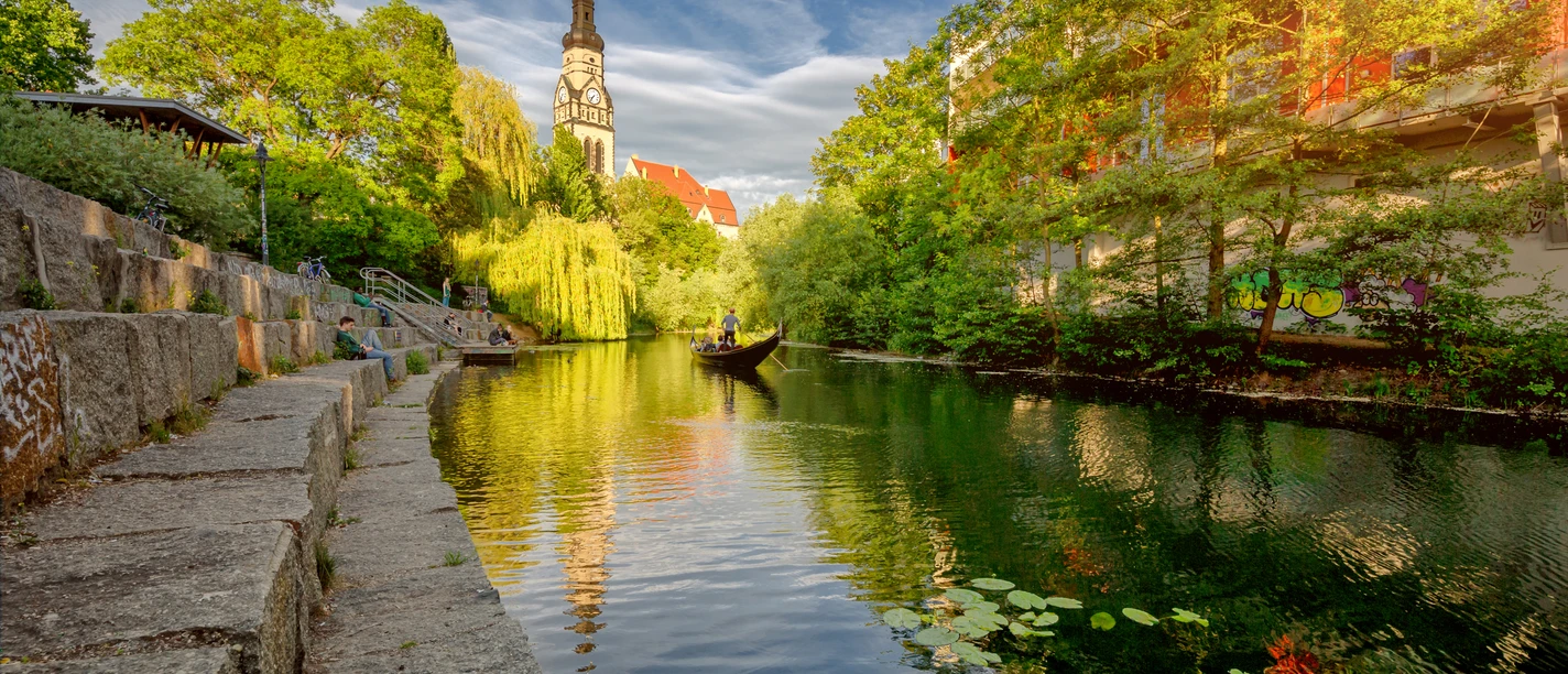 View of the Karl Heine Canal with gondola on the water, Leipzig Water City, paddle tour