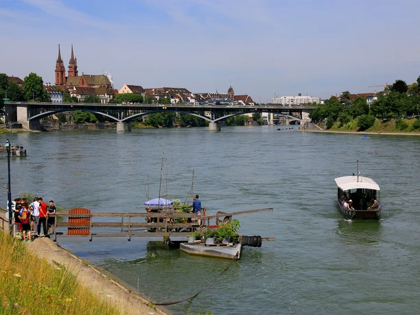 Rhine ferry in Basel, with the cathedral in the background.